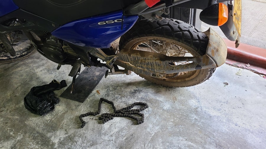 broekn chain next to a motorcycle
